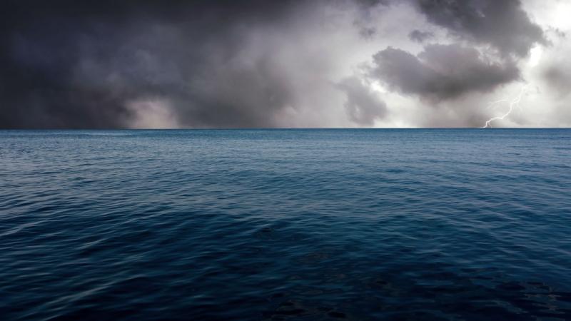 Ocean surface with a storm in the background