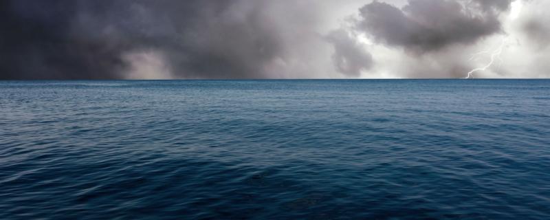 Ocean surface with a storm in the background